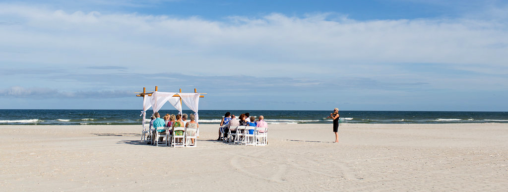 Maura playing violin for a beach wedding ceremony on Wrightsville Beach