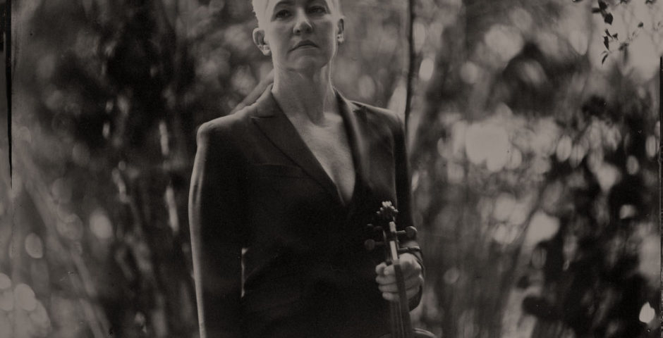 Old-timey photo of Maura and her violin