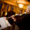 Professional violin performance at indoor event in Wilmington, NC