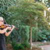 Maura with her violin at outdoor event in Carolina Beach, NC