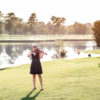 Maura playing the violin on a Wilmington golf course