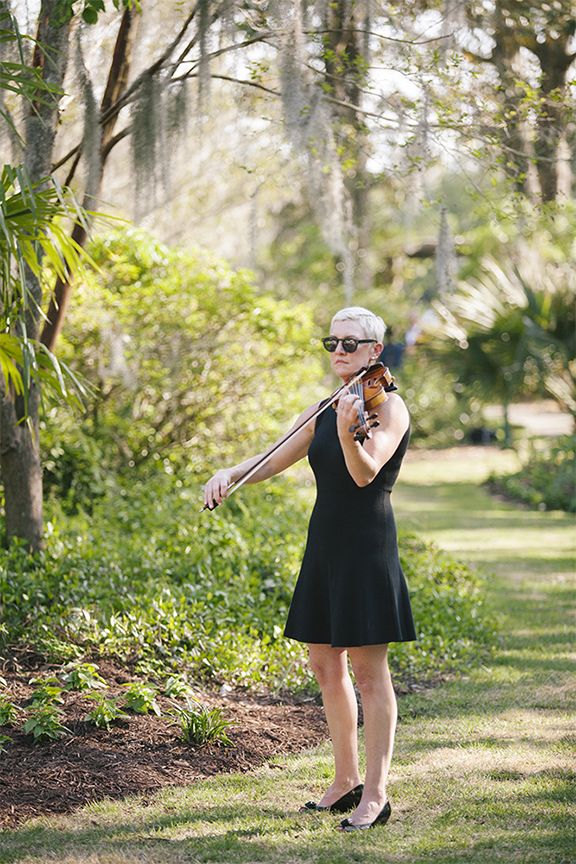Maura playing at an outdoor wedding in Airlie Garden in Wilmington, NC